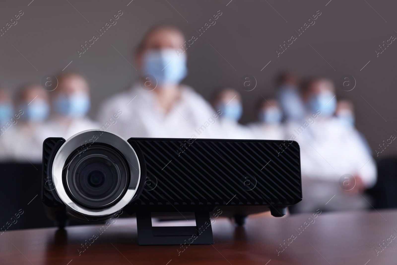 Photo of Video projector on table during medical conference