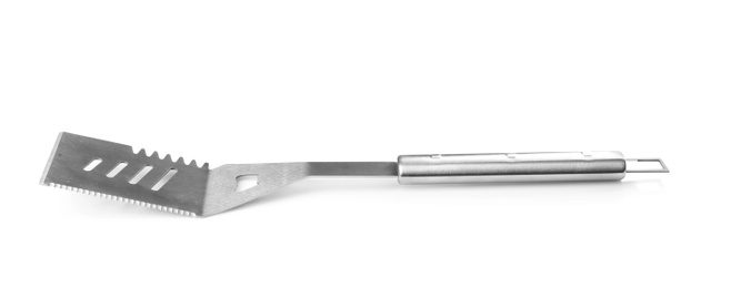 Photo of New metal barbecue spatula on white background