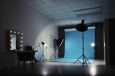 Modern photo studio interior with professional lighting equipment