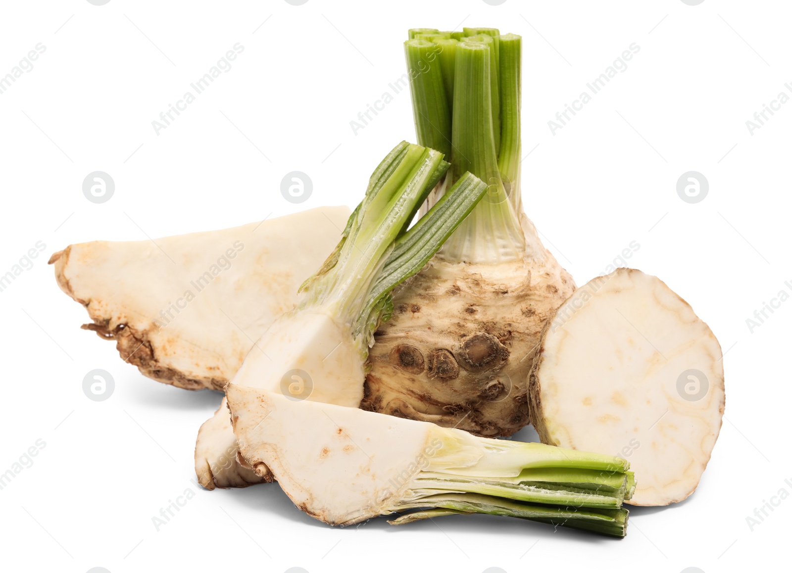 Photo of Whole and cut celery roots isolated on white