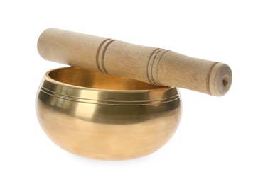 Photo of Golden singing bowl and mallet on white background.  Sound healing