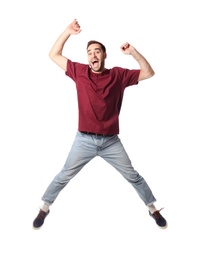 Photo of Full length portrait of happy handsome man jumping on white background