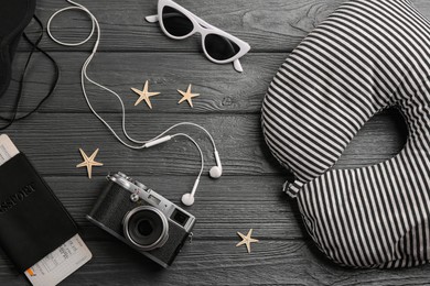 Image of Flat lay composition with striped travel pillow on wooden background
