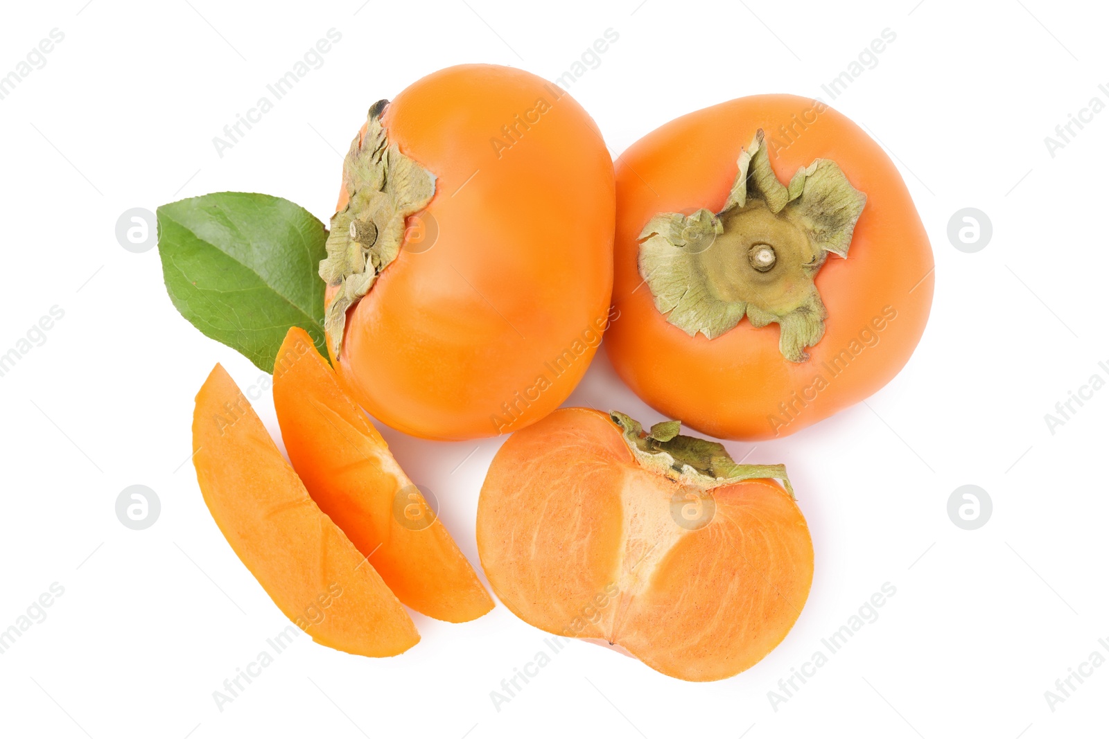 Photo of Whole and cut delicious ripe juicy persimmons on white background, top view