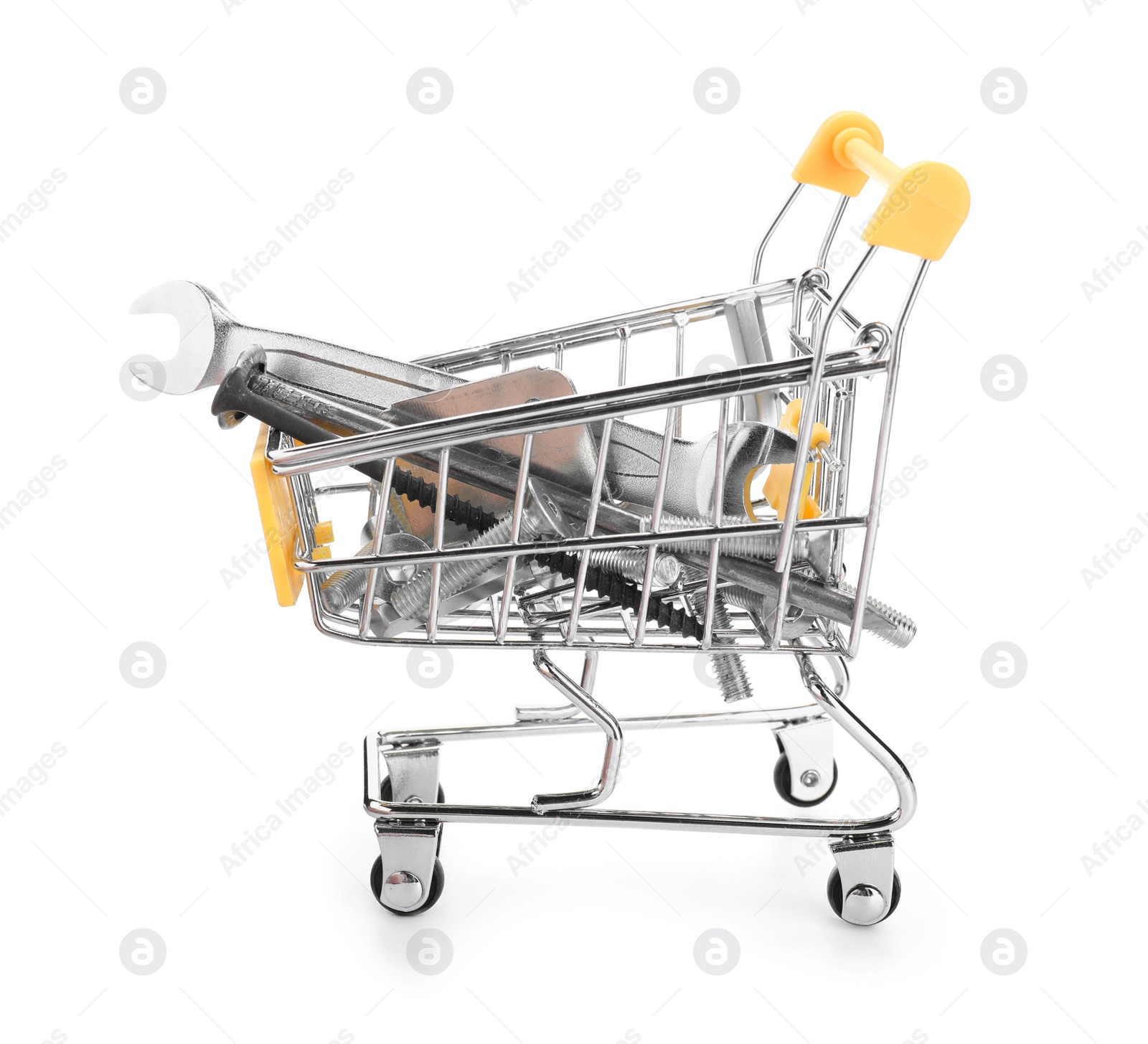 Photo of Different construction tools in shopping cart isolated on white
