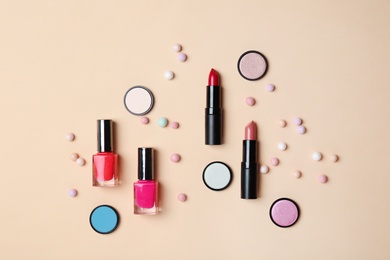 Photo of Decorative makeup products on color background