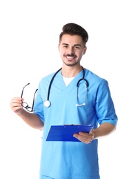 Photo of Young medical student with clipboard and glasses on white background
