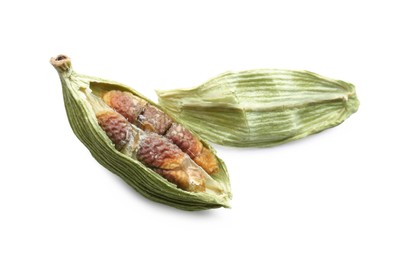 Photo of Dry green cardamom pod with seeds on white background, closeup