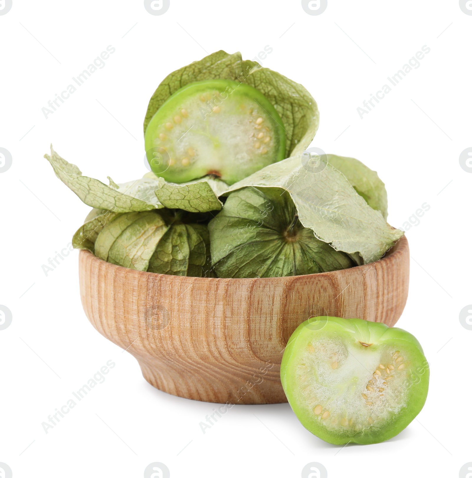 Photo of Fresh green tomatillos with husk in bowl isolated on white