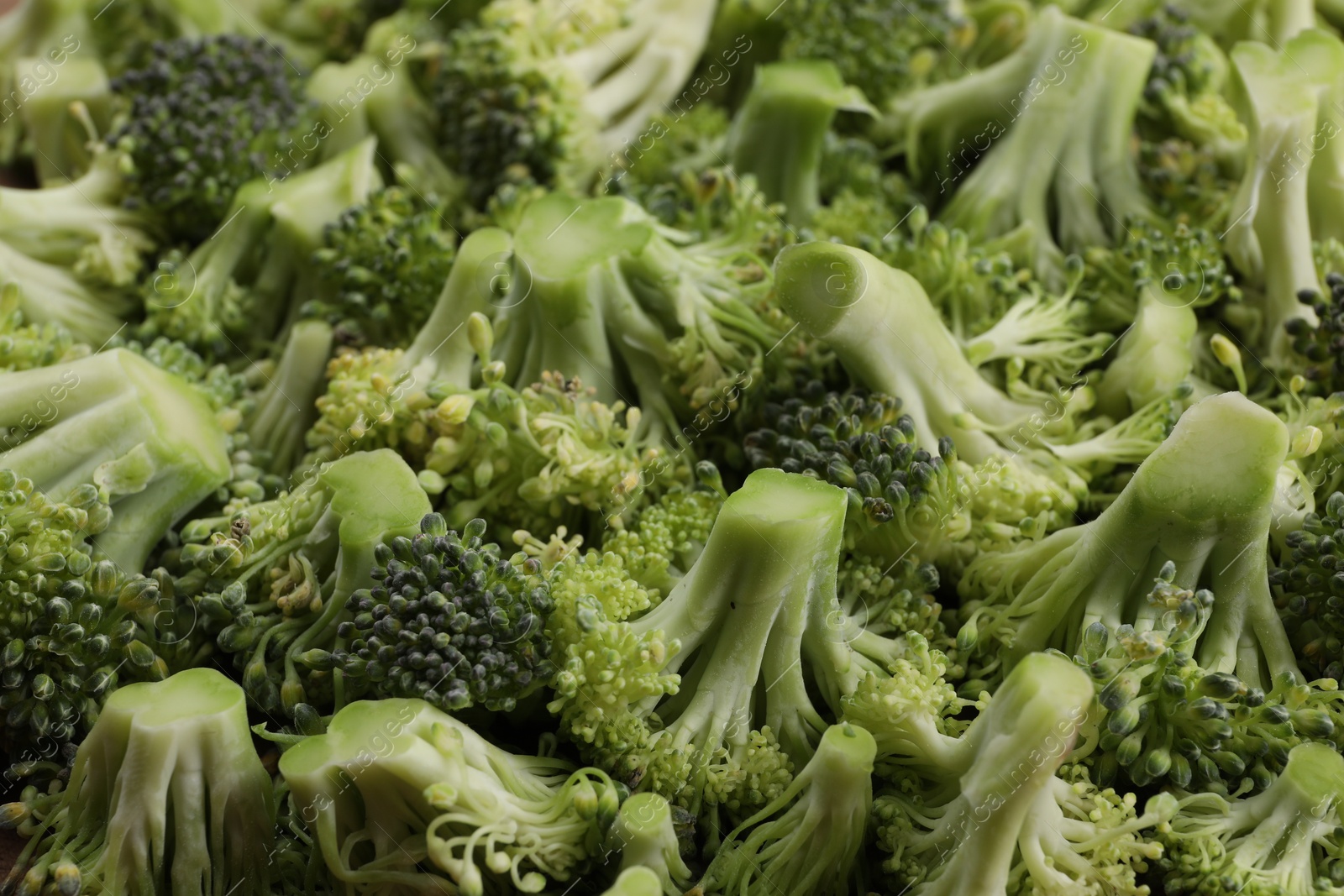 Photo of Fresh raw broccoli as background, closeup view