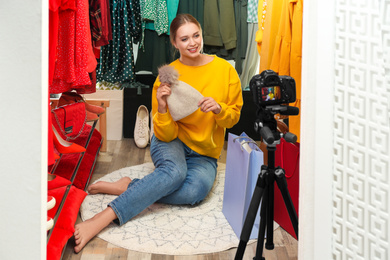 Photo of Fashion blogger recording new video in dressing room