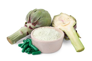 Photo of Fresh artichokes, pills and powder isolated on white