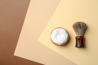 Flat lay composition with men's shaving accessories and space for text on color background