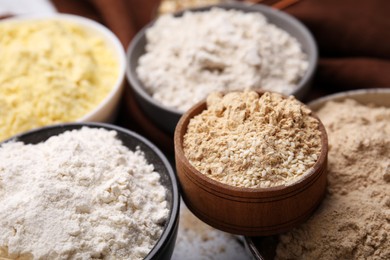 Photo of Bowls with different types of flour, closeup