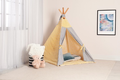 Cozy child room interior with play tent near window