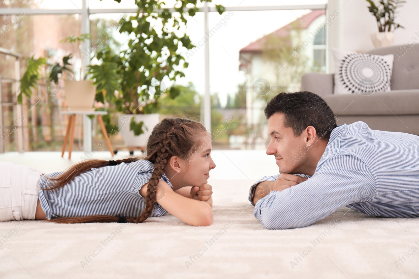 Photo of Father with cute child on floor at home. Happy family