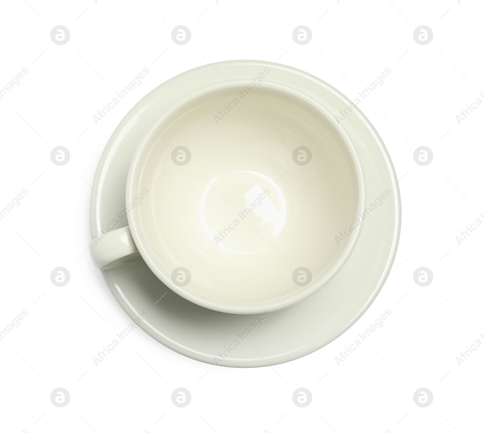 Photo of Ceramic cup with saucer isolated on white, top view