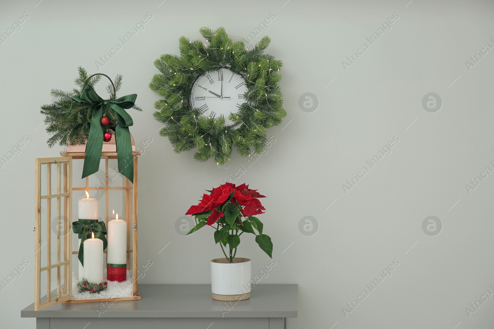 Photo of Wooden decorative Christmas lantern on grey table indoors. Space for text