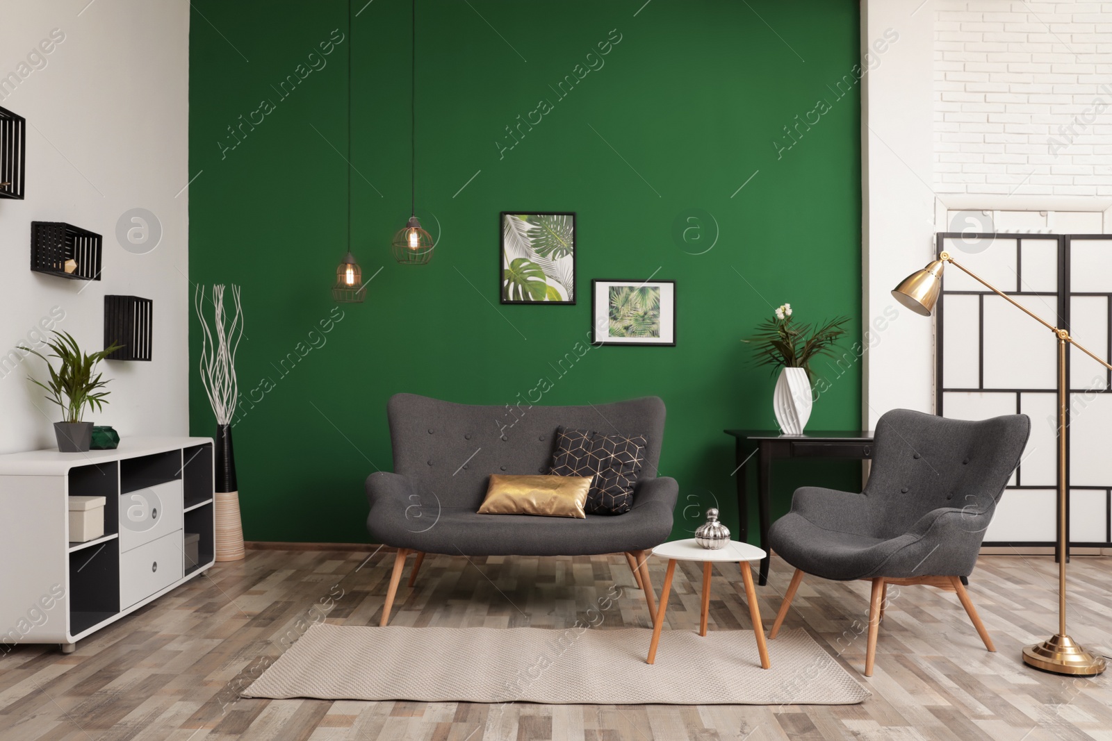 Photo of Modern living room interior stylish sofa near green wall