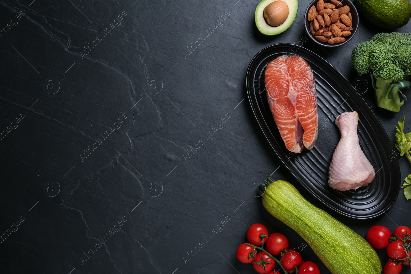 Photo of Flat lay composition with keto diet products on black table, space for text