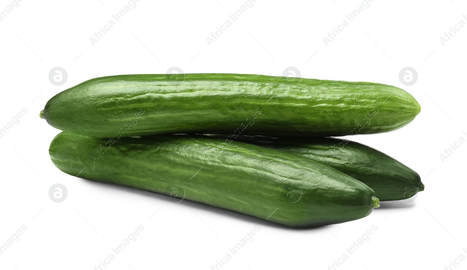 Photo of Many long fresh cucumbers isolated on white