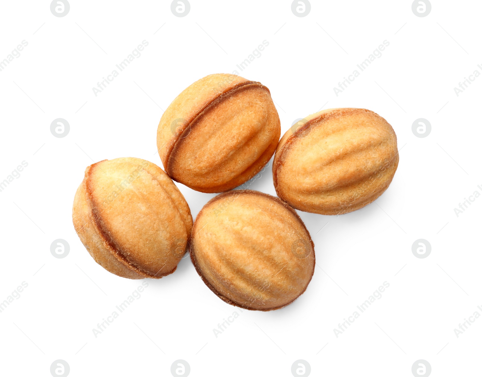 Photo of Delicious nut shaped cookies with condensed milk on white background, top view