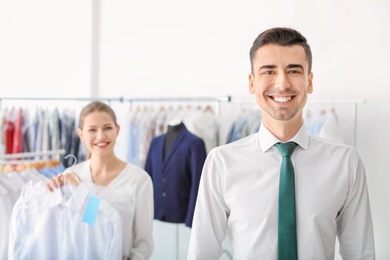 Photo of Portrait of young businessman at dry-cleaner's