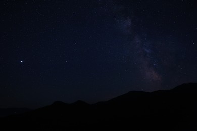 Photo of Beautiful view of starry sky over mountains at night