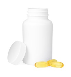 Photo of Blank jar and vitamin capsules isolated on white