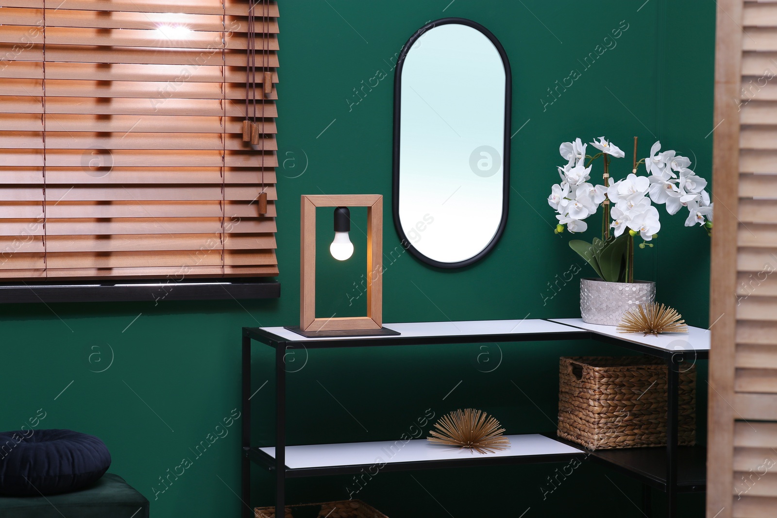 Photo of Modern hallway interior with console table and beautiful orchid flower