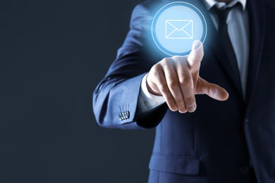 Image of Electronic mail. Businessman pointing at virtual image of envelope, closeup