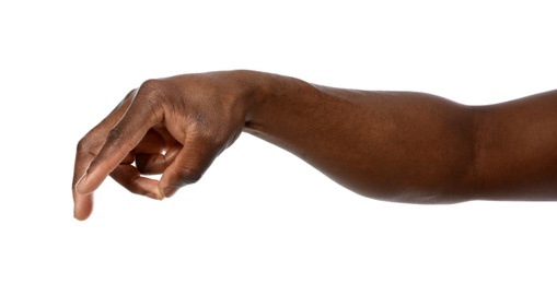 Photo of African-American man pointing at something on white background, closeup