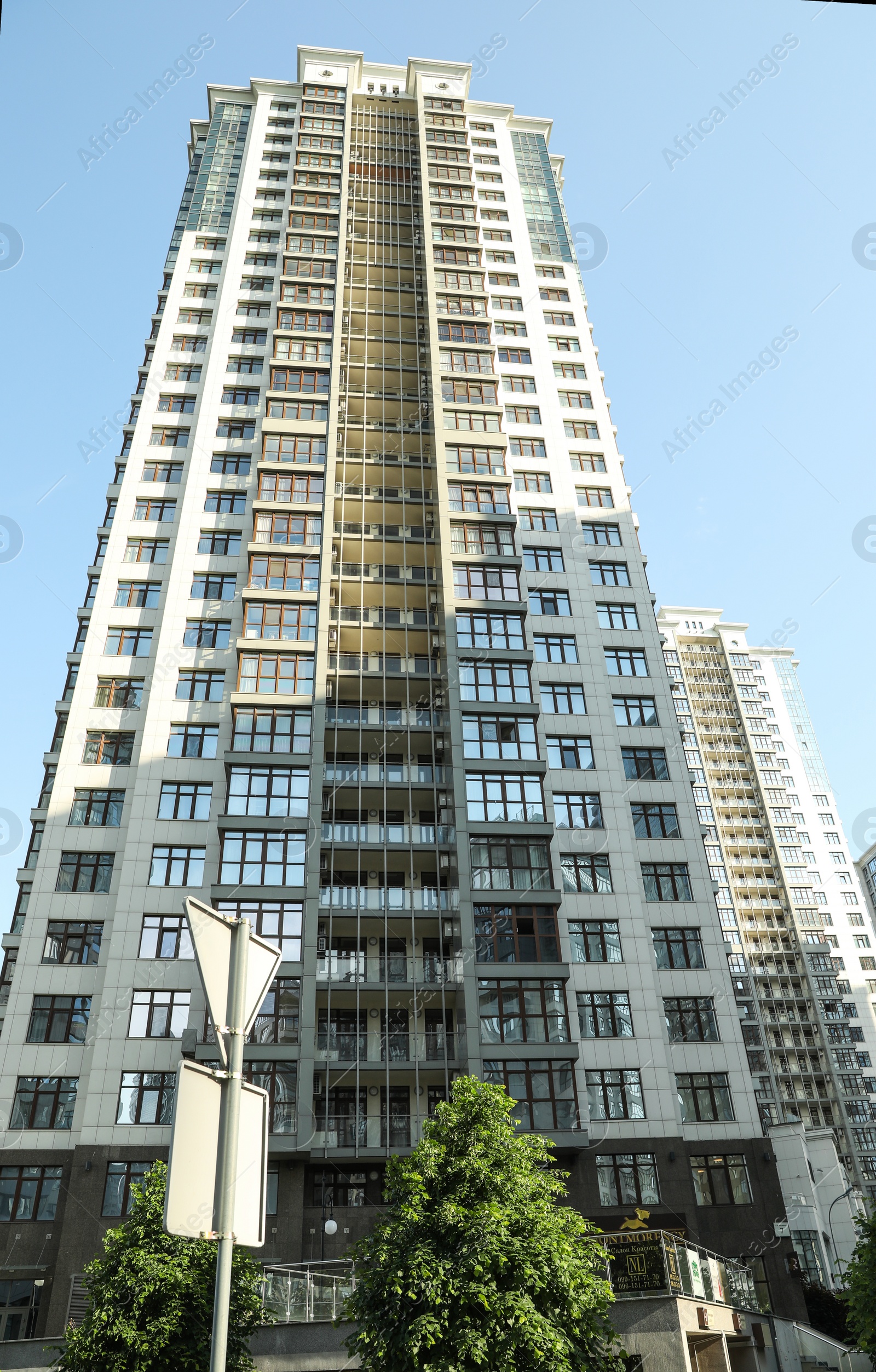 Photo of KYIV, UKRAINE - MAY 21, 2019: Beautiful view of modern housing estate in Pecherskyi district on sunny day, low angle