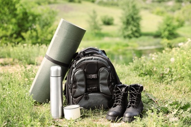 Photo of Set of camping gear outdoors on sunny day