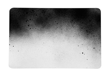 Photo of Canvas covered with black spray paint on white background, top view