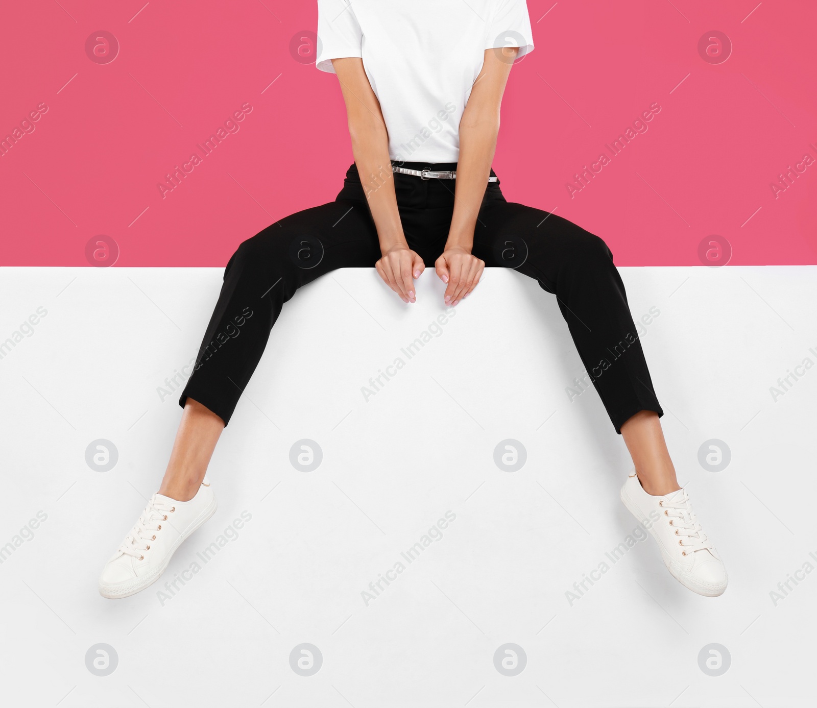 Photo of Woman wearing stylish shoes on color background, closeup