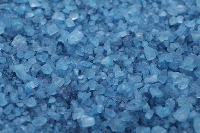 Photo of Blue sea salt as background, closeup view