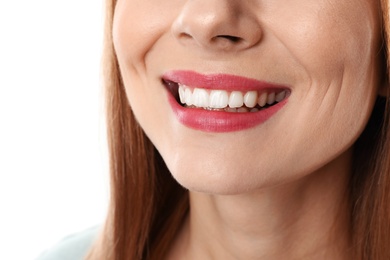 Photo of Smiling woman with perfect teeth on white background, closeup