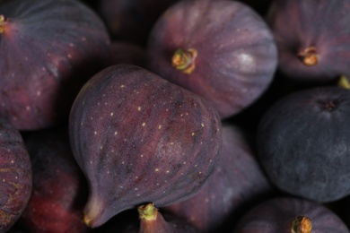 Photo of Tasty fresh figs as background, closeup view