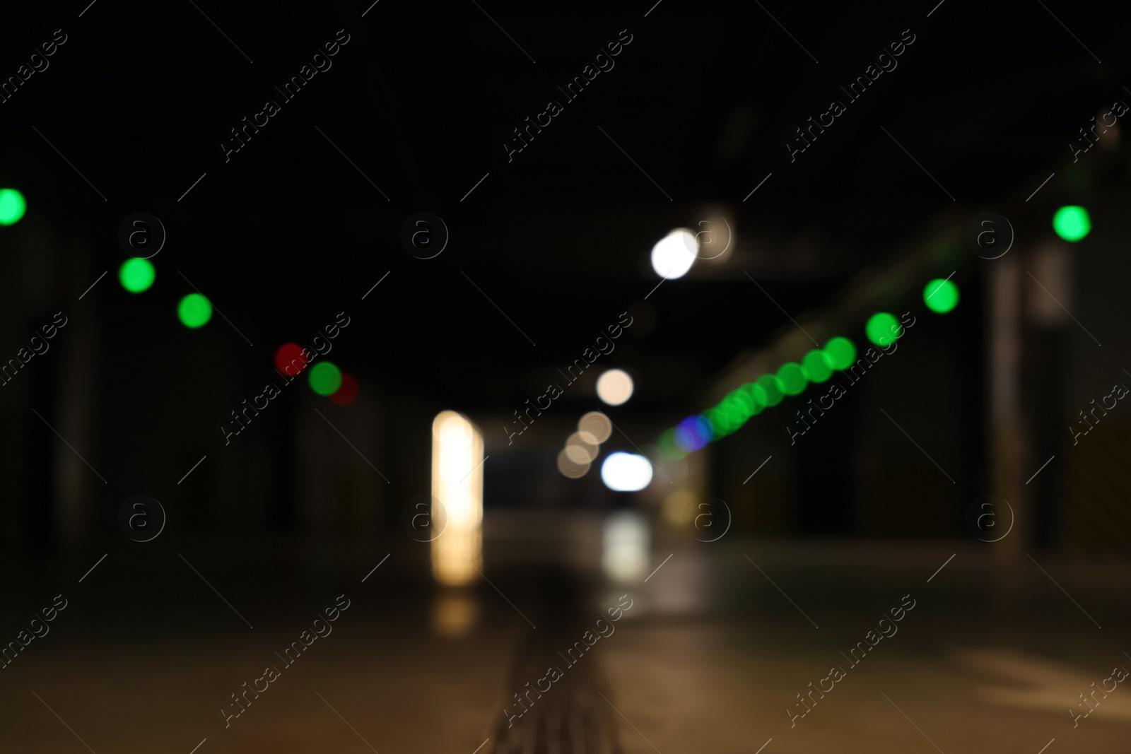 Photo of Blurred view of car parking garage at night