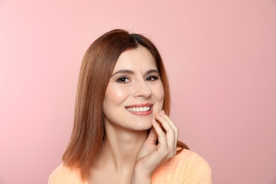 Photo of Smiling woman with perfect teeth on color background