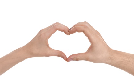 Photo of Man and woman making heart with their hands on white background, closeup