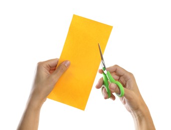 Photo of Woman cutting yellow paper with scissors on white background, closeup