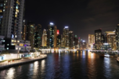 Photo of DUBAI, UNITED ARAB EMIRATES - NOVEMBER 03, 2018: Night cityscape of marina district with illuminated buildings, blurred view