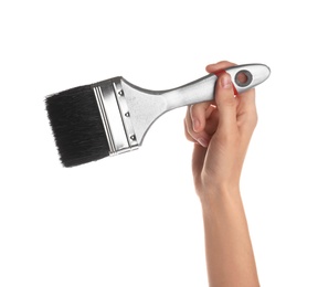 Photo of Woman holding paint brush on white background, closeup