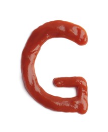 Photo of Letter G written with ketchup on white background