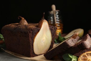 Photo of Tasty pear bread on table, closeup. Homemade cake