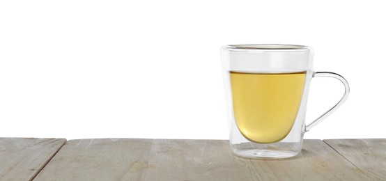 Photo of Refreshing green tea in cup on wooden table against white background