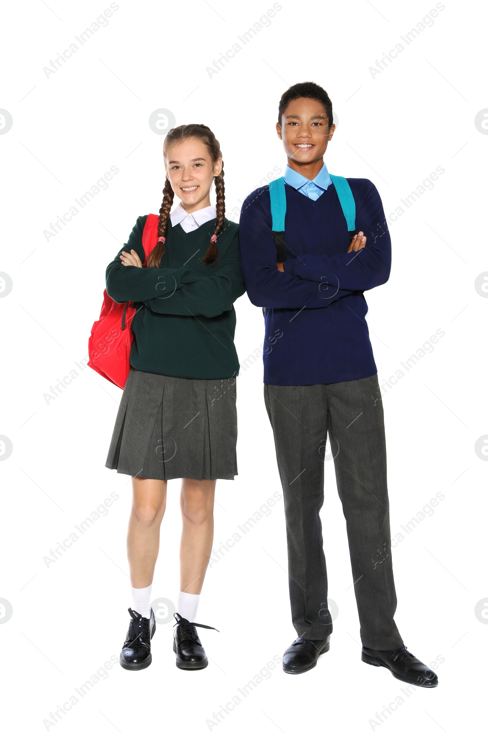 Photo of Teenagers in stylish school uniform on white background