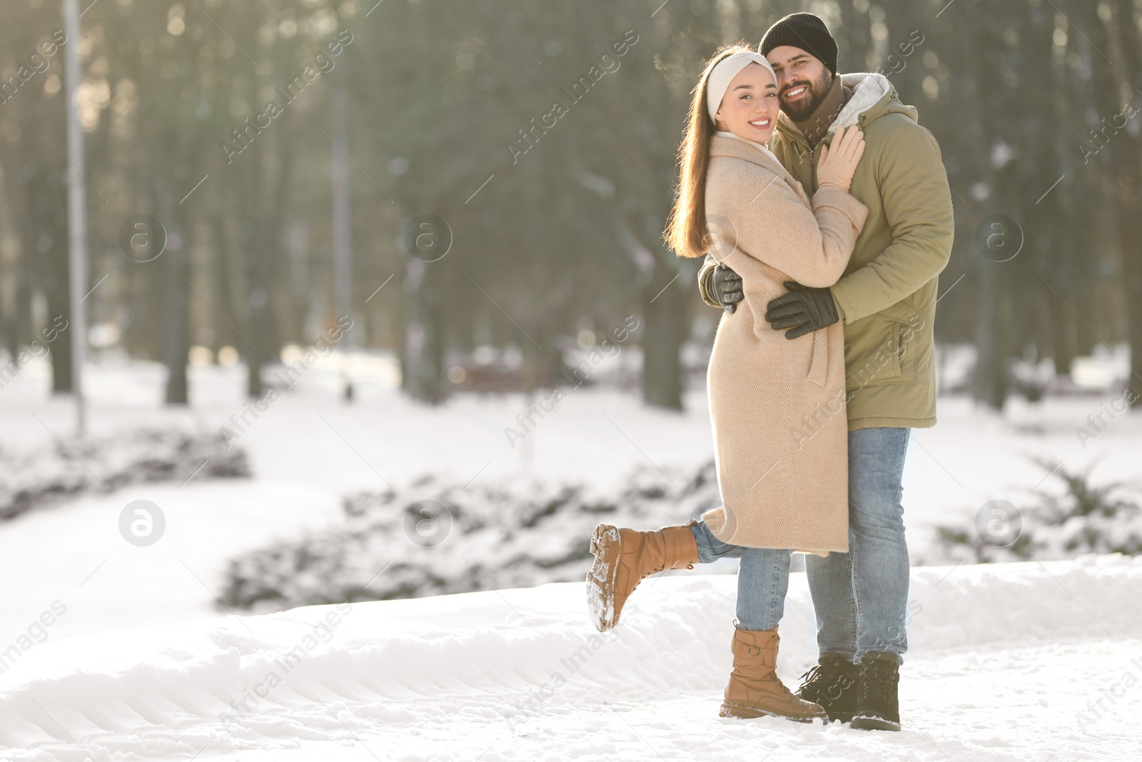 Photo of Beautiful young couple enjoying winter day outdoors